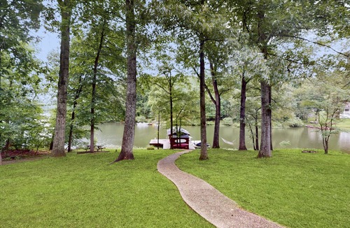 Morgan II House | Spacious waterfront escape with screened porch, water slide, kayak, & games