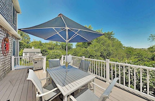 Sagamore Beach House | Spacious wooded retreat near canal & beach with deck & alfresco dining