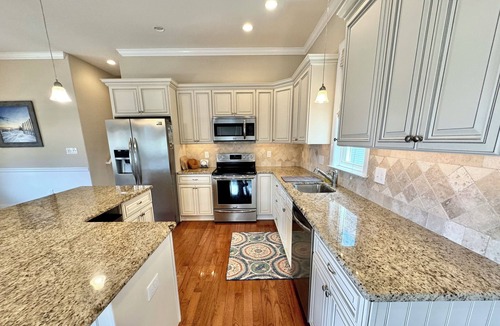 North End Condo | Sunny shore escape—steps to beach, boards & family fun!☀️🌊🏖️