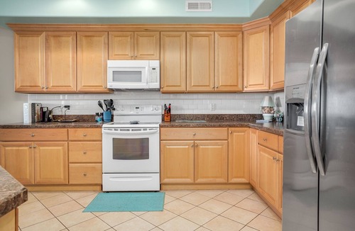 Chincoteague House | Sunset Bay Villa 206 | Luxury Condo w/Waterside Balcony, Gourmet Kitchen + Pool & Fitness
