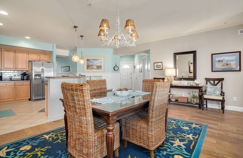 Chincoteague House | Sunset Bay Villa 206 | Luxury Condo w/Waterside Balcony, Gourmet Kitchen + Pool & Fitness