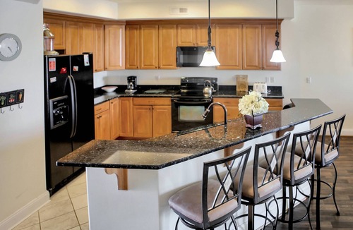 Chincoteague House | Sunset Bay Villa 212 | Waterfront Balcony + Pool + Walk to Downtown + Pet Friendly