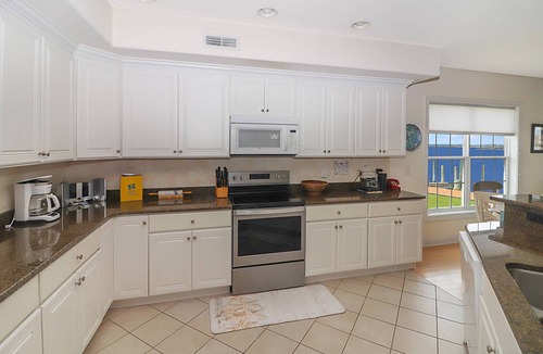 Chincoteague House | Sunset Bay Villa 101 - Waterfront condo w/shared pool!