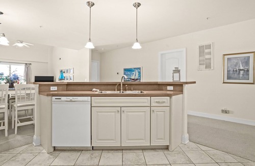 Chincoteague House | Sunset Bay Villa 312 | Waterfront Balcony + 14' Boat Slip + Pool Access