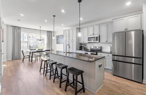 Rio House | This fully furnished, 4 bedroom/3.5 bath townhome immersed in the Belvedere neighborhood is less than 2 years old with all the updates and amenities on the interior for comfortable living. 9-12 month lease preferred for lower monthly rent amount.