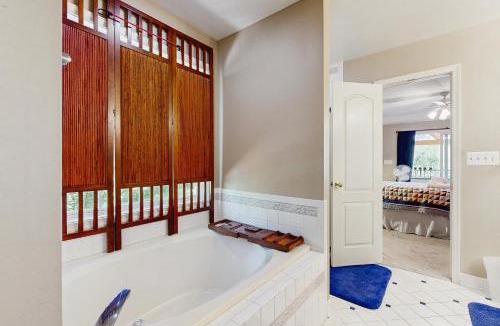Bumpass House | Tranquil lakefront retreat with hot tub, screened porch, kayaks, and more
