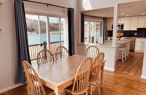 East Falmouth House | Tranquil Waterfront Retreat dock perfect Family Getaways 7 min drive to beach