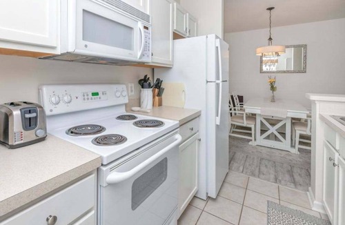 Rehoboth Beach Condo | Villas at Bay Crossing dog-friendly condo with pool, balcony, water views, & W/D
