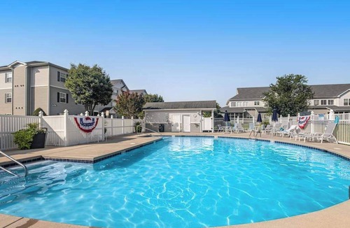 Rehoboth Beach Condo | Villas at Bay Crossing dog-friendly condo with pool, balcony, water views, & W/D