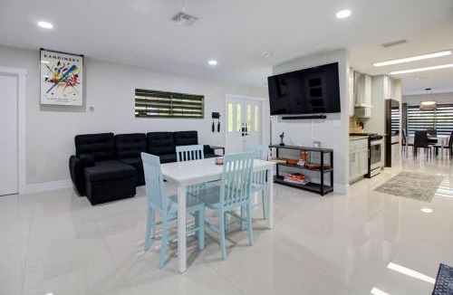 Miami Lakes House | Vista Azul Lake Front Home with Hot Tub and Swim Spa, Fishing Dock, Gym, Game Room with Darts, Ping Pong, A Pool Table and more!