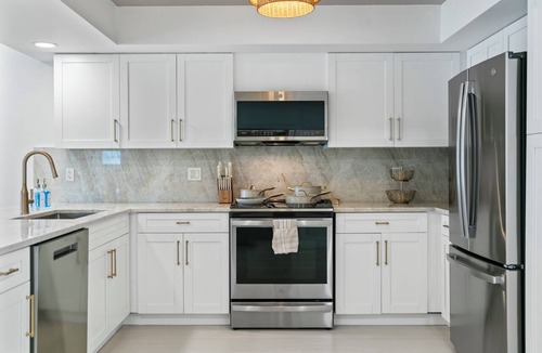 Imperial Point House | Waterfront 3 King Suites - Dock + Pool Near Beach - Paddleboards Included
