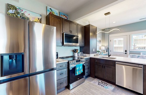 Colington Harbour Apartment | Waterfront apartment with lovely bay views, outdoor shower & fishing access