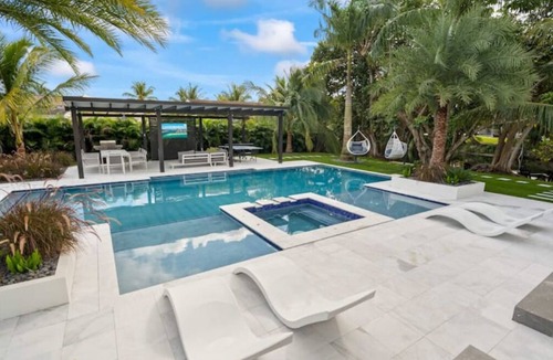 Golden Glades Villa | Waterfront Estate 7BR Heated pool Spa BBQ Basketball