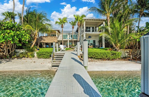 Boynton Beach Villa | Waterfront oasis w/white sand beach, pool & dock minutes to Delray & Palm Beach!