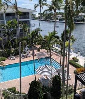 Boca Raton Apartment | Waterfront Retreat Views, Pool, Hot Tub, Gym Walk to Beach & Boca Resort!