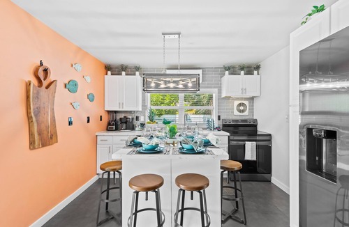 Middle River Terrace House | Welcome to the Bohemian, a Heated Salt-Water Tropical Pool Home!