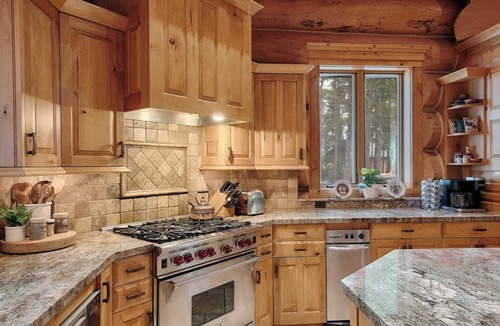 Marion House | Where lake days are long and everyone has a place to stay. Entire Estate property including the Large Custom Log Home and the Boat Motel on 50 Acres, Sleeping 26 Total