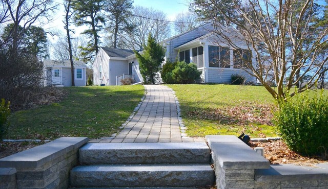 3 bedroom 2 bath Renovated Ranch with Pond Views on peaceful private 1.5 acre lot in North Falmouth