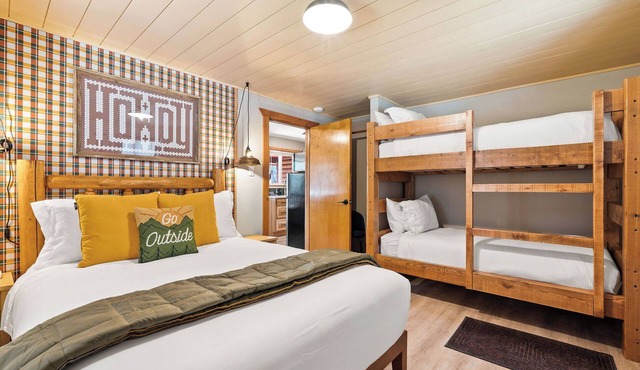 Authentic Montana log cabin, 15 min to Glacier. Queen bed + twin bunks, full kitchen & covered porch. Real adventure, real comfort — no tent required.