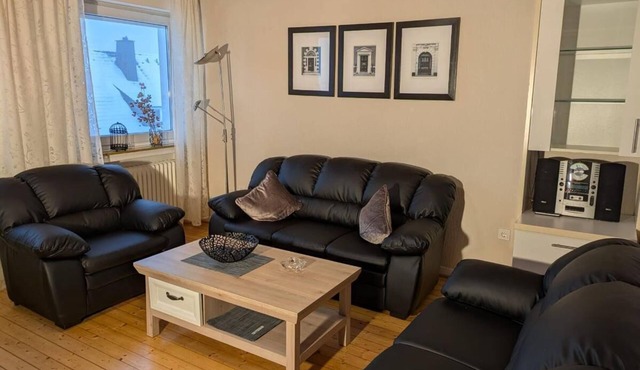 Bright apartment (81sqm) with wood-burning stove and balcony with view in Hallenberg