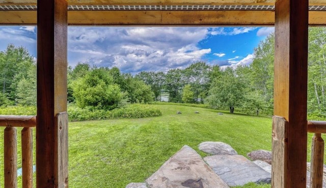 Bright three-level home with water views, jetted tub, firepit, and pool table