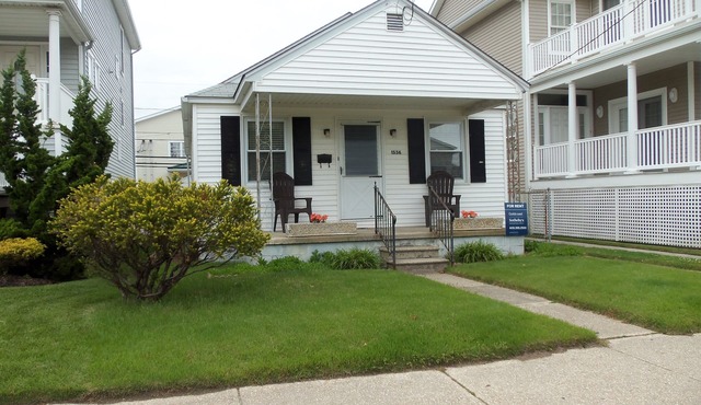 Centrally located near downtown shopping and restaurants and just a short walk to the beach and boardwalk. Large rear parking pad for 4 cars, picnic table and a fun basketball net in back too!