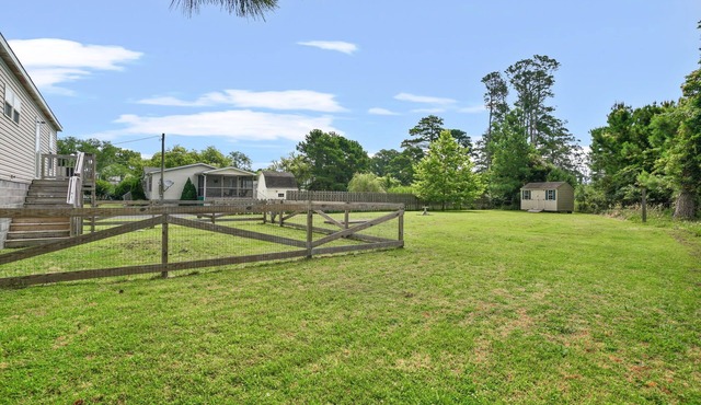Charlie's Cove | Central Chincoteague Home w/Fenced Yard, Soaking Tub, Den & Pet Friendly Stay