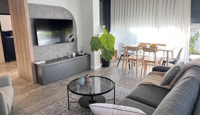 Charming Beachside Apartment with Private Garden in Side