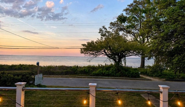 Coastal retreat with direct beach access and sweeping Chesapeake Bay water views