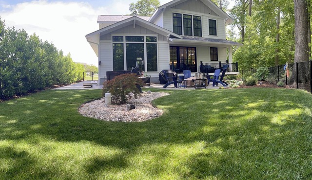 Custom 4-bedroom home w/boat slip, private fenced backyard & swimming pool.