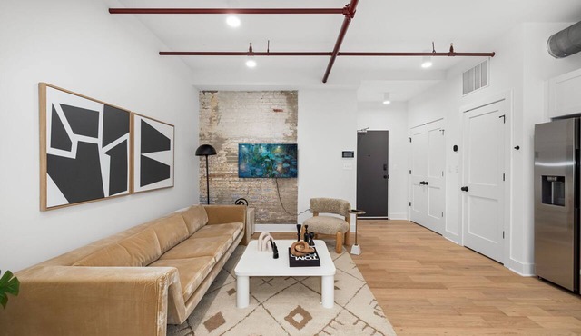 Design-forward flat in Old Town's most iconic building. Exposed brick, bold red ceiling pipes, corner bedroom bathed in natural light. Modern kitchen, quiet side street. Steps from 100+ restaurants & waterfront. A LovableBNB Collection listing.