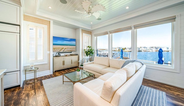 Discover the epitome of coastal living in this exceptional bayfront residence, a true gem boasting.