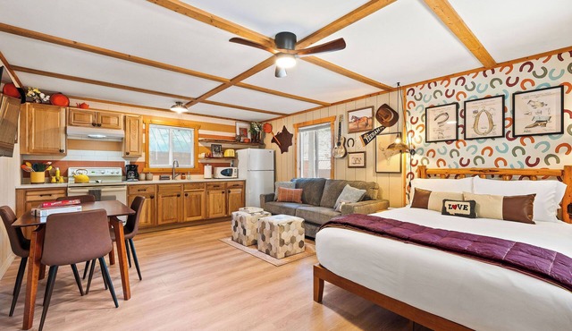 Ditch the tent for "Retro-Chic" comfort. This spacious studio pairs high-end design with Big Sky soul—featuring a full kitchen, log-frame bed, and a modern walk-in shower. The ultimate West Glacier basecamp for your bucket-list family tour.