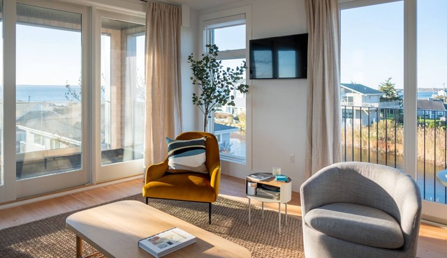 Enjoy 180 degree views of the Vineyard Sound from this new modern beach house!