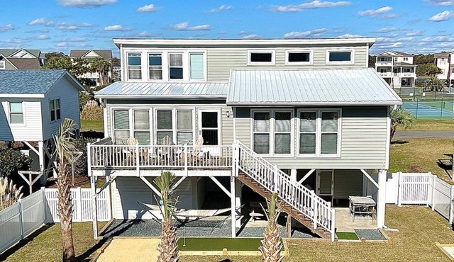 Enjoy oceanfront views at How Sweet The Sound in Holden Beach, NC; perfect for families.