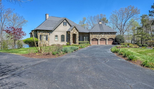 Lakefront stunner with pool, 50' waterslide, hot tub, & dock - dog-friendly
