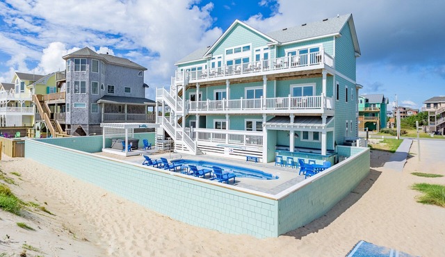 Lovely beachfront home with hot tub, pool, game room, & central AC