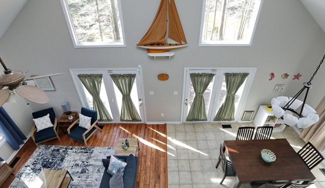 One of a kind waterfront house with pond/creek, deck, privacy and beach access.