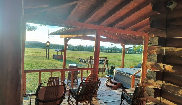 Private log cabin with hot tub and mountain views on 14 acres, pet friendly!