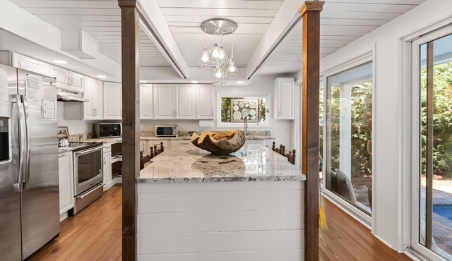 Renovated in 2022, 5BR, heated pool, firepit, lush backyard character & charm!