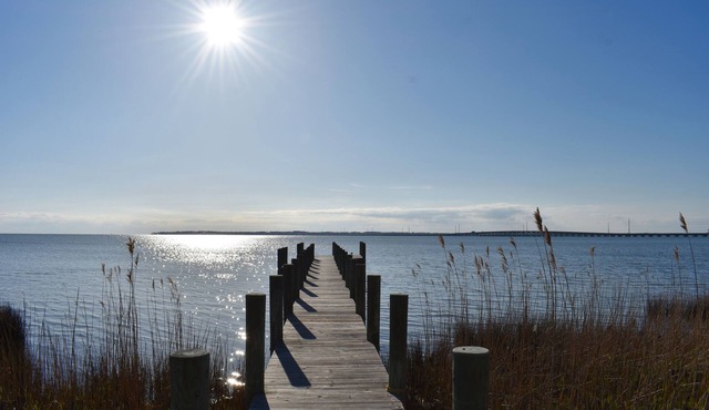 Soundfront sunsets, private dock, 4 king beds, screened porch, deck & bedrooms.