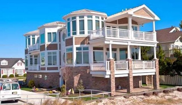 Super upscale, one of a kind designed beach front property just steps away from the beach