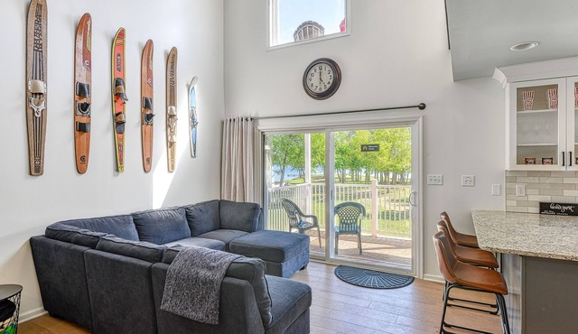 Three-story lakefront home w/covered boat slip, and tennis/pickleball access
