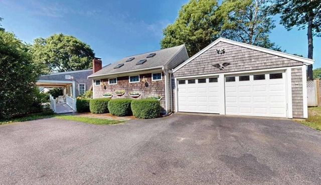 Tree-lined home with lovely yard, decks & private beach access - walk to town
