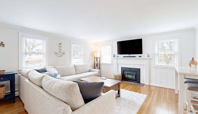 Two-story dog-friendly retreat with enclosed yard, playset, W/D, & firepit