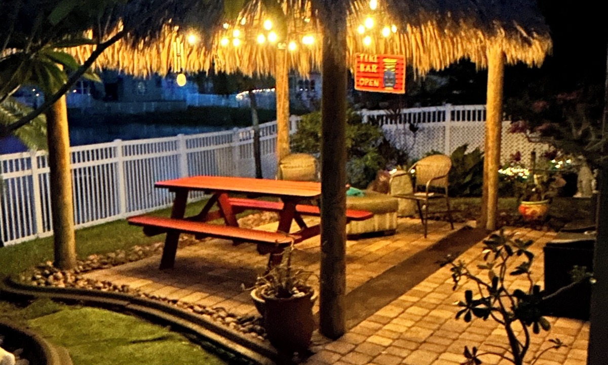 Miramar House | Beautiful lakefront retreat with outdoor kitchen, tiki hut and spa.