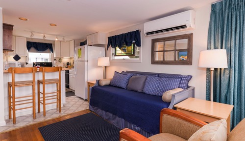 Deluxe Room  Kitchenette / Private Balcony 2 Queen Beds & 1 Sofa Bed  
