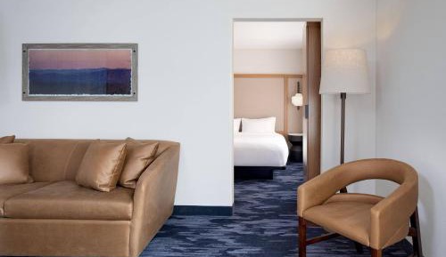 King Suite with Roll-In Shower, Sofa Bed and Sitting Area - Mobility Access