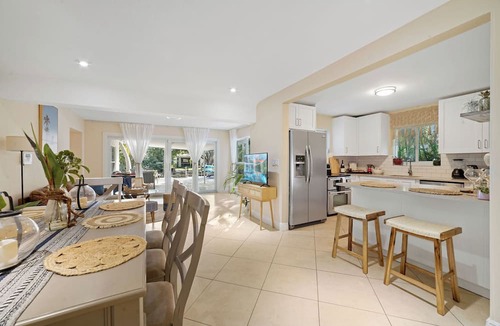 North Central Hollywood House | Waterfront Oasis: 4 bd, Heated Pool, Private Dock, Beach, Fireplace, BBQ, Kayaks